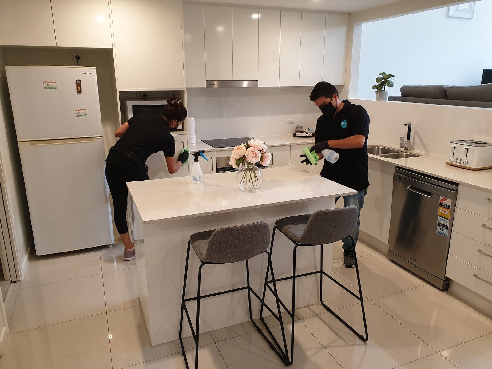 Two contractors from the Relax! We Clean network completing a kitchen turnover